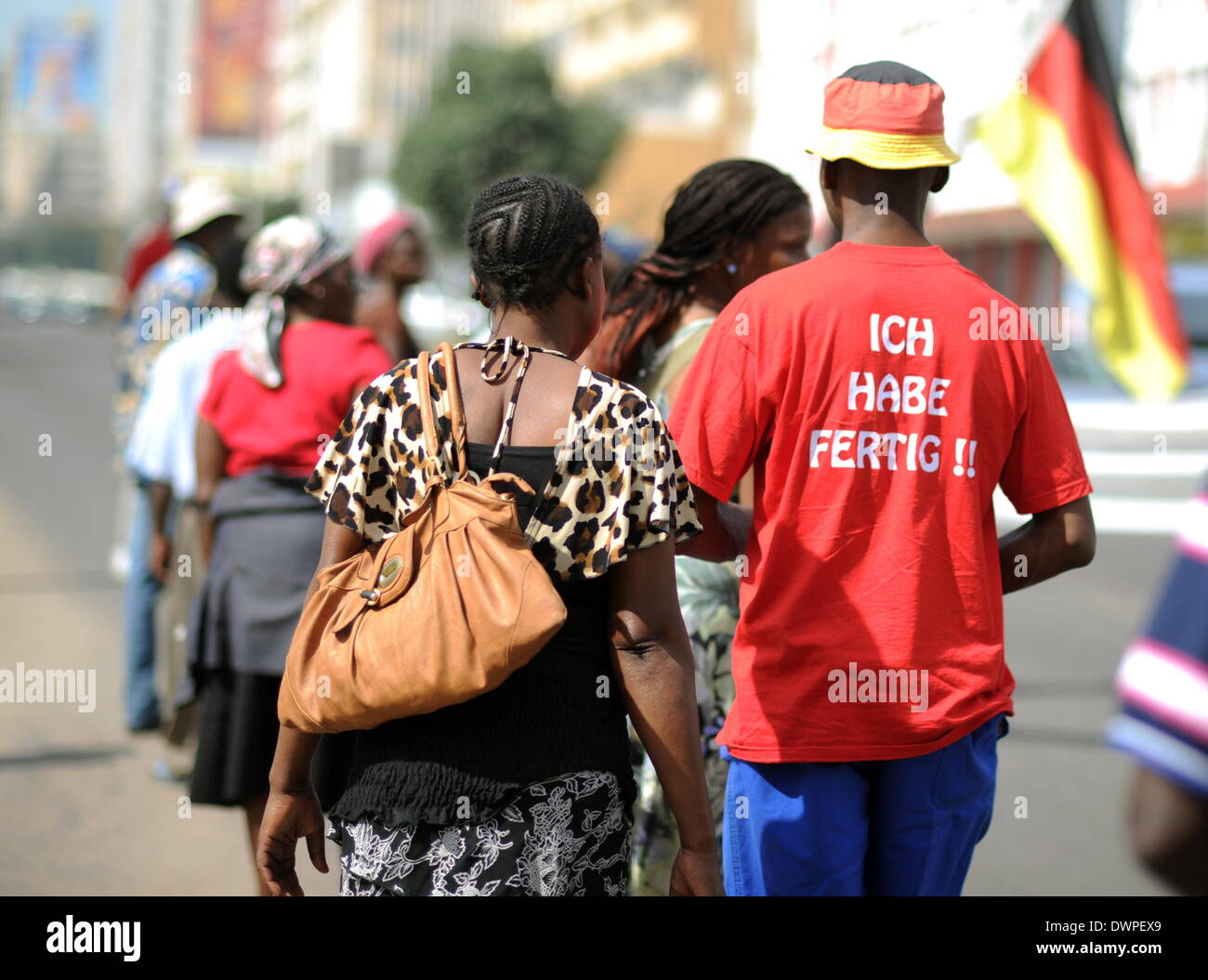The so-called 'Madgermanes' (crazy Germans) demonstrate in Maputo, Mozambique, 14 August 2013. The former guest workers in the GDR have been protesting in the capital of Mozambique every wednesday at 11 o'clock for the last 20 years. After Mozambique became independent in 1975, tens of thousdands of people went to work in the GDR. They received 40 percent of their wages at once while 60 percent went to the state Mozambique to pay off debts with the promise that the money would be paid to the workers upon their return. The Madgermanes are still waiting for their 60 percent. Photo: Britta Peders Stock Photo