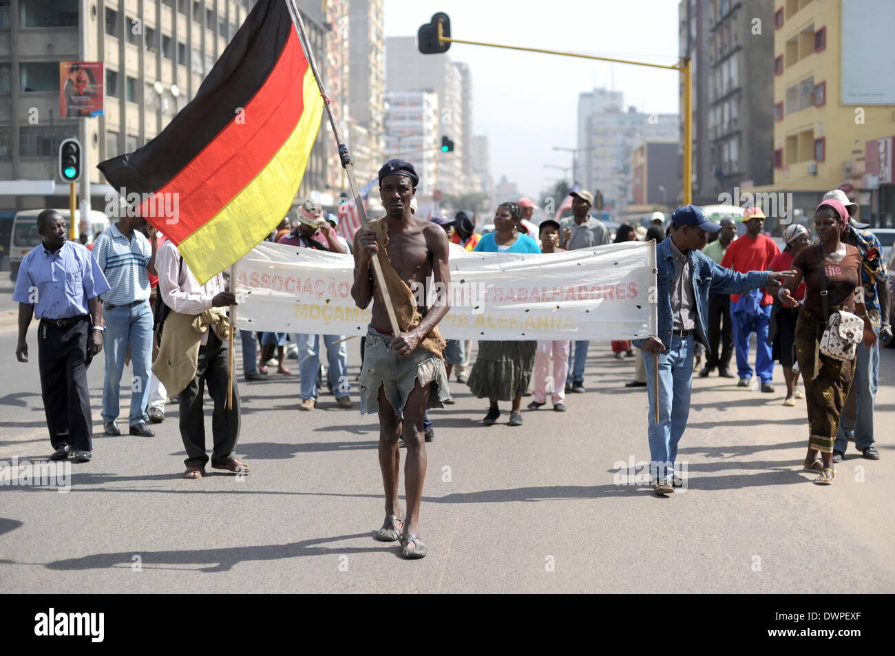 The so-called 'Madgermanes' (crazy Germans) demonstrate in Maputo, Mozambique, 14 August 2013. The former guest workers in the GDR have been protesting in the capital of Mozambique every wednesday at 11 o'clock for the last 20 years. After Mozambique became independent in 1975, tens of thousdands of people went to work in the GDR. They received 40 percent of their wages at once while 60 percent went to the state Mozambique to pay off debts with the promise that the money would be paid to the workers upon their return. The Madgermanes are still waiting for their 60 percent. Photo: Britta Peders Stock Photo
