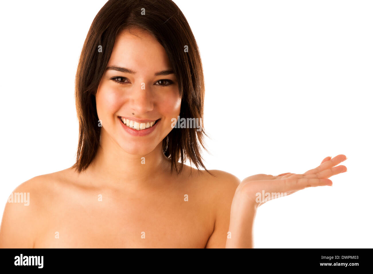 Beautiful young asian caucasian girl holding her hand over cpyspace isolated over white background Stock Photo