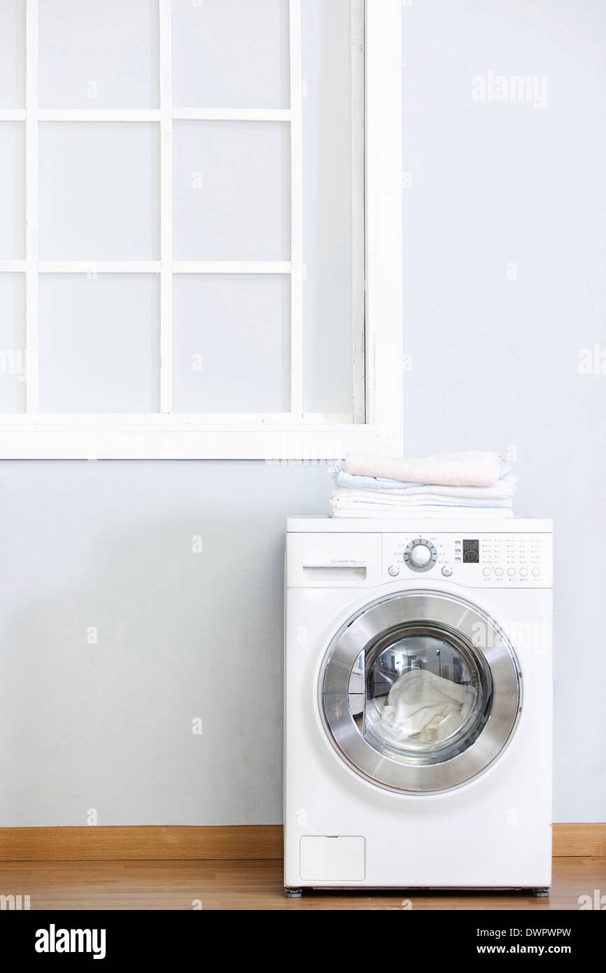 a washing machine in the house Stock Photo