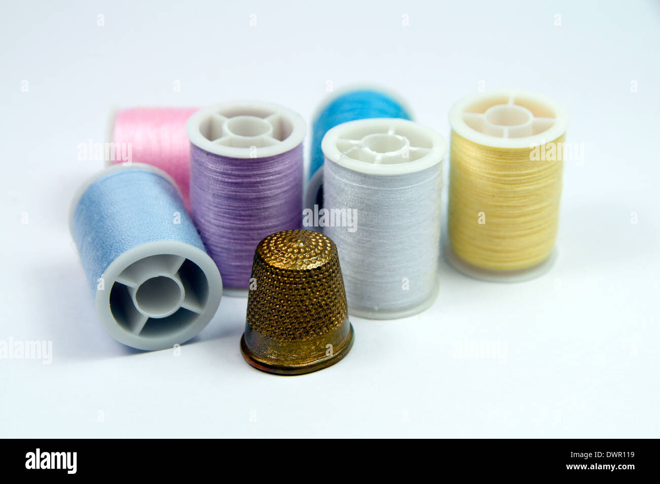 Thimble and cotton reels Stock Photo