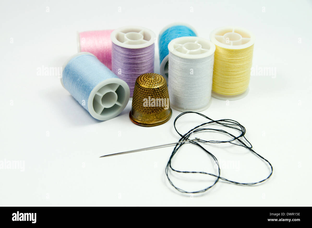 Thimble and cotton reels Stock Photo