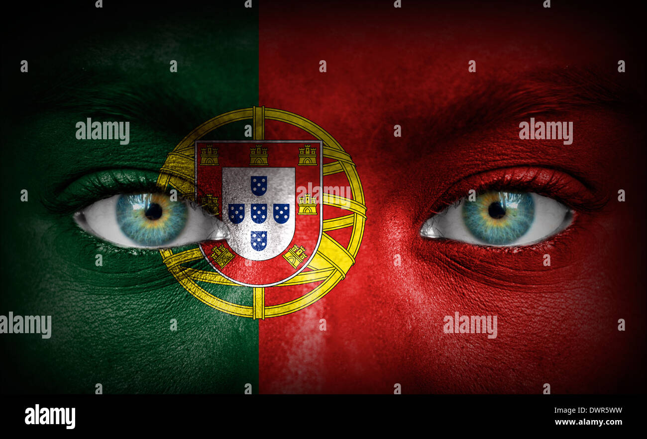 Human face painted with flag of Portugal Stock Photo