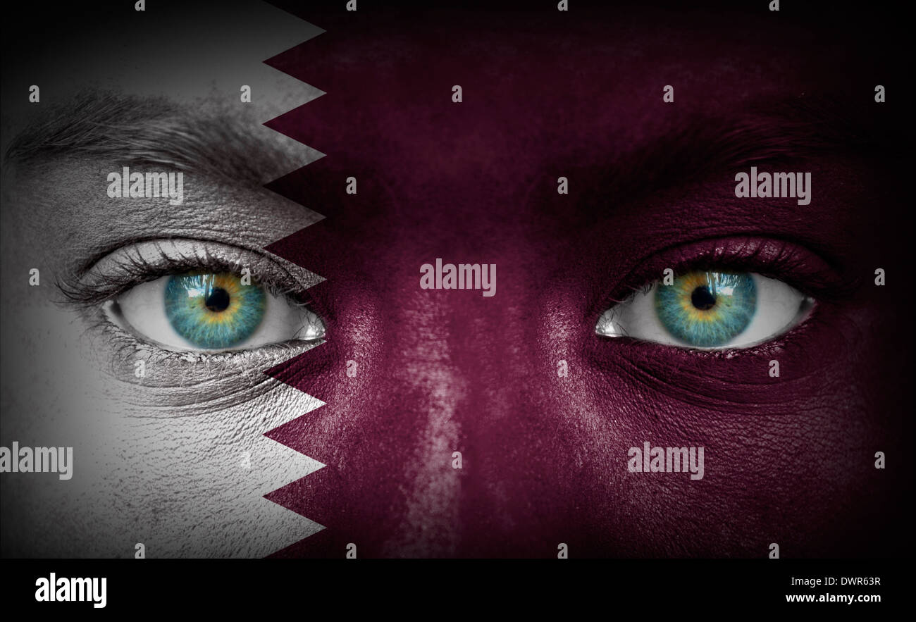 Human face painted with flag of Qatar Stock Photo - Alamy