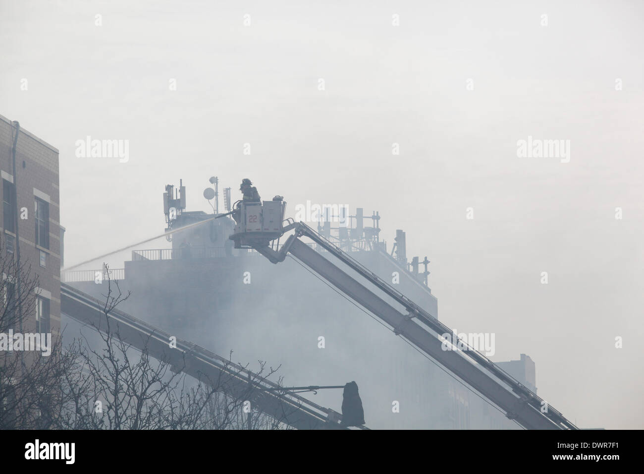 Harlem, New York City. 12 March 2014. New York City firefighters battle four alarm blaze in Harlem Credit:  Cal Vornberger/Alamy Live News Stock Photo