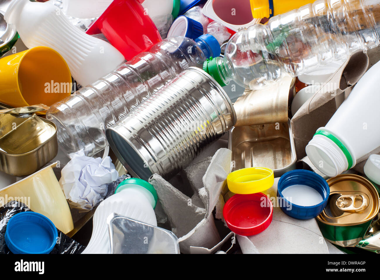 Reusable waste. Metal, plastic, paper and glass before segregation Stock Photo