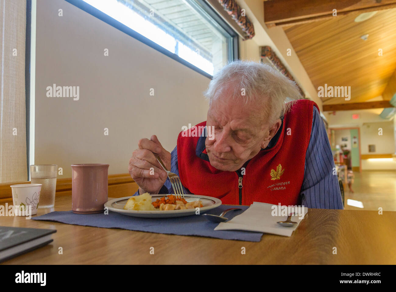 Man in Dementia Care Home eating lunch Stock Photo Alamy