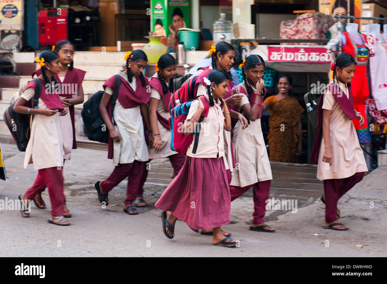South Southern India Tamil Nadu Madurai street scene young schoolchildren schoolgirls school girls in uniform walking Stock Photo