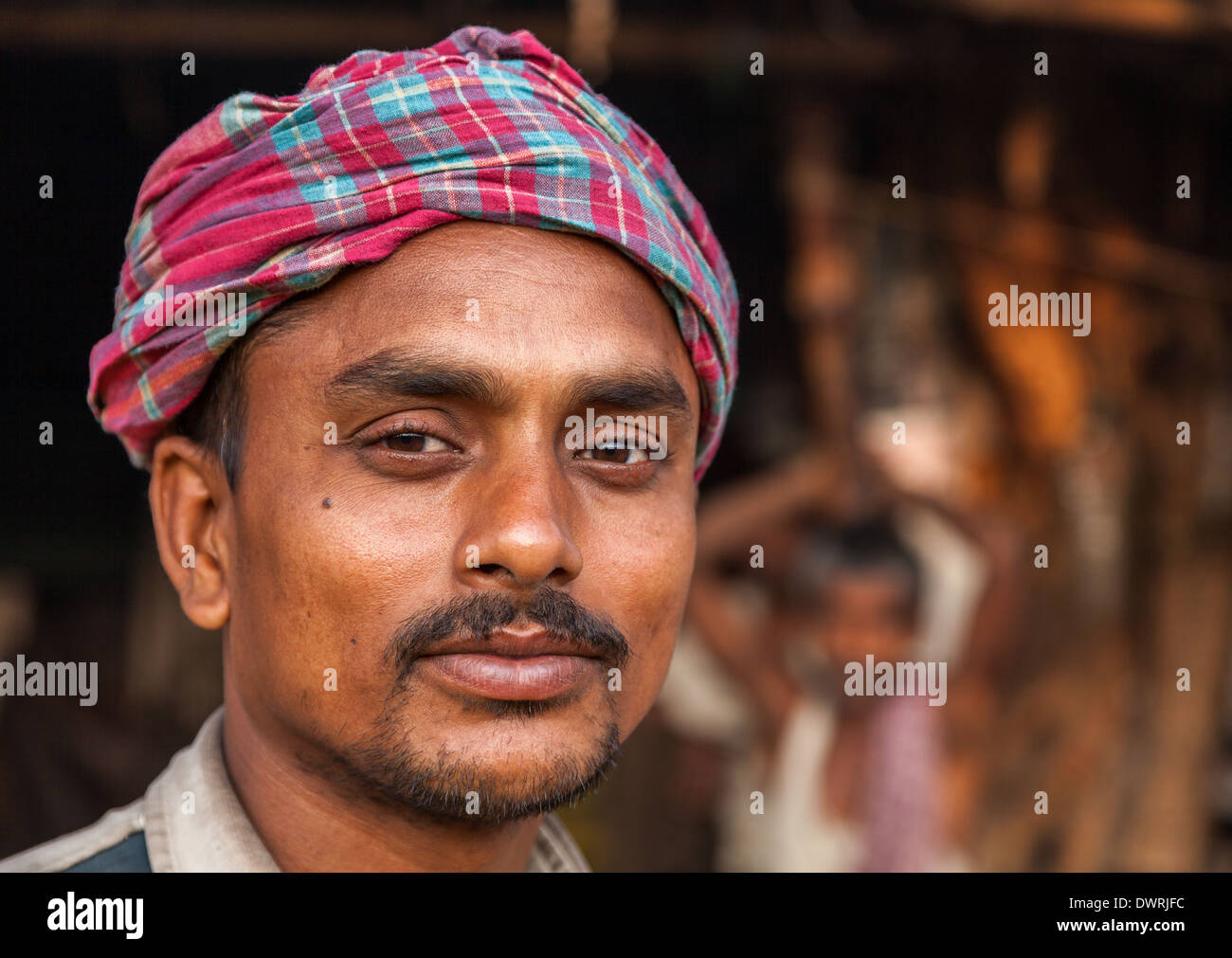 Portrait of an Indian flower seller, Malik Ghat Flower Market, Kolkata, West Bengal, India Stock Photo