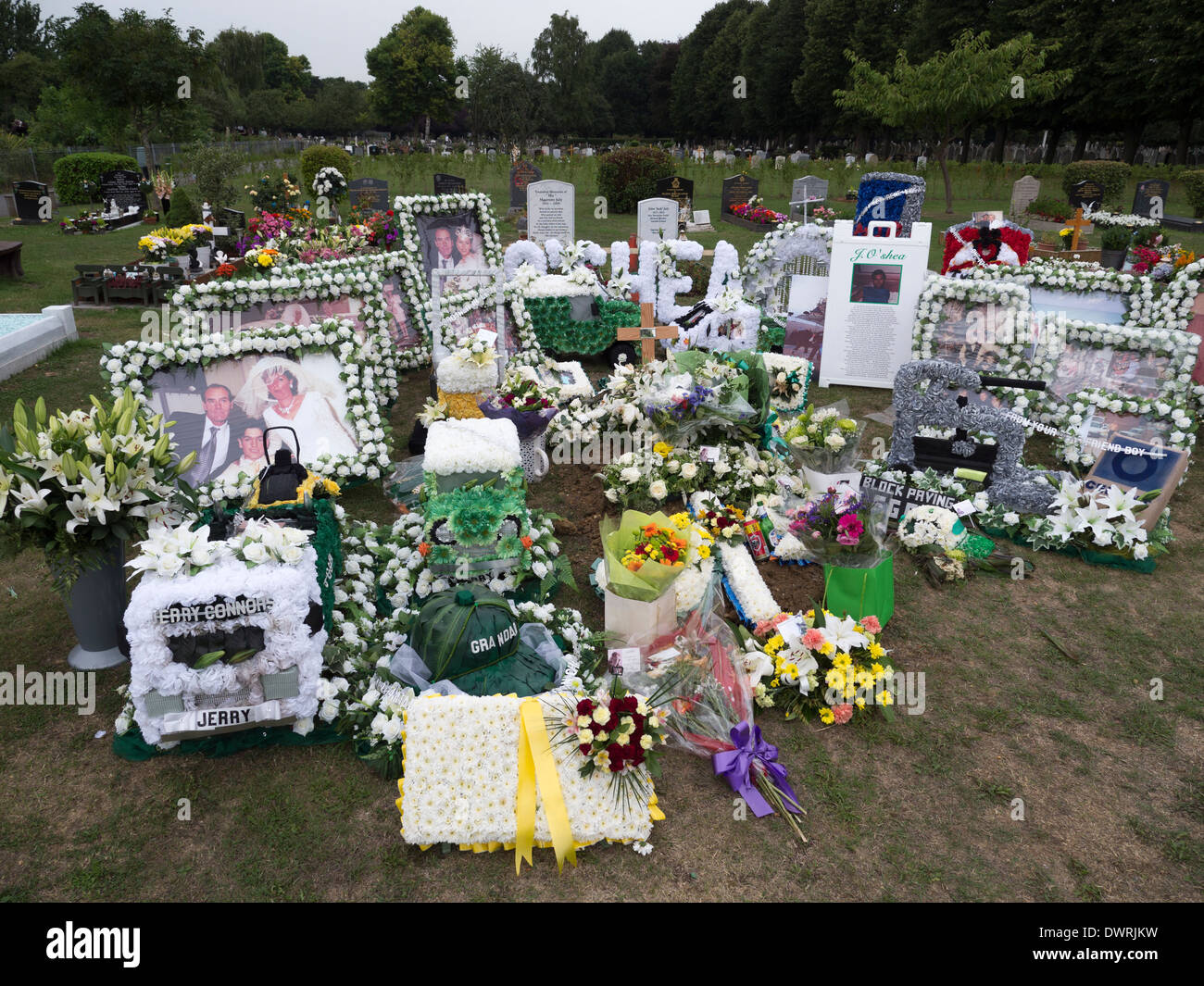 Extravagant displays of flowers at a cemetery in London Stock Photo
