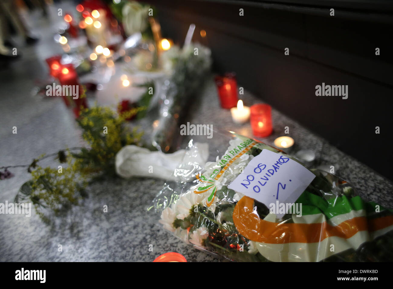 Madrid, Spain. 11th Mar, 2014. A bouquet among candles with a banner on it sais ''we won't forget you'' at the Atocha Bombing Memorial, in Madrid, Spain, Tuesday March 11, 2014, in remembrance of those killed and injured in the Madrid train bombings marking the 10th anniversary of Europe's worst Islamic terror attack. The attackers targeted four commuter trains with 10 shrapnel-filled bombs concealed in backpacks during morning rush hour on March 11, 2004. Credit:  Rodrigo Garcia/NurPhoto/ZUMAPRESS.com/Alamy Live News Stock Photo