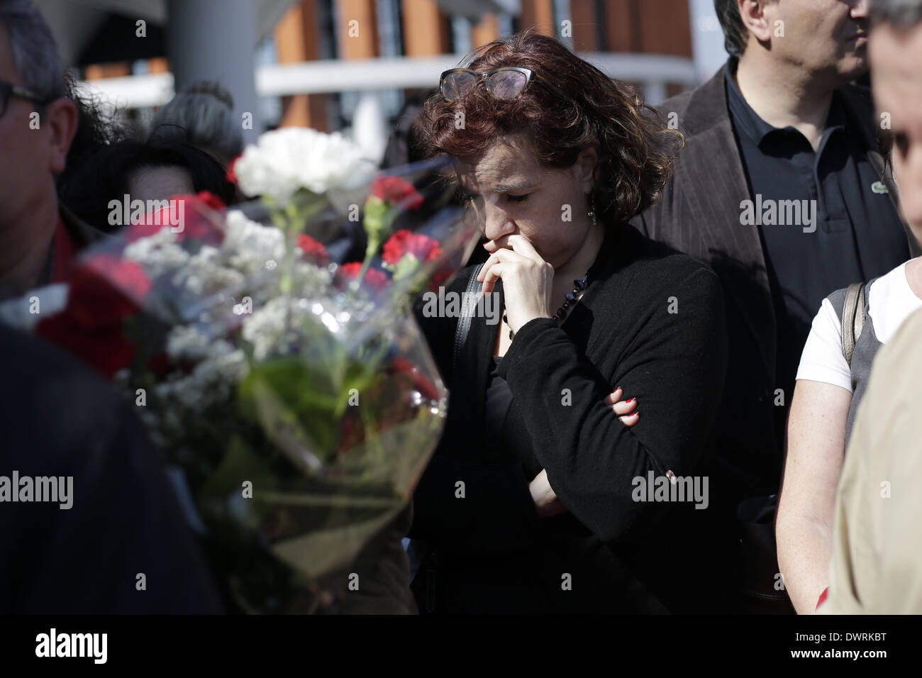 Madrid, Spain. 11th Mar, 2014. A woman gestures during an event outside Atocha's train station in remember of the people killed in the Madrid train bombings in Madrid, Spain, Tuesday March 11, 2014, in remembrance of those killed and injured in the Madrid train bombings, marking the 10th anniversary of Europe's worst Islamic terror attack. The attackers targeted four commuter trains with 10 shrapnel-filled bombs concealed in backpacks during morning rush hour on March 11, 2004. Credit:  Rodrigo Garcia/NurPhoto/ZUMAPRESS.com/Alamy Live News Stock Photo