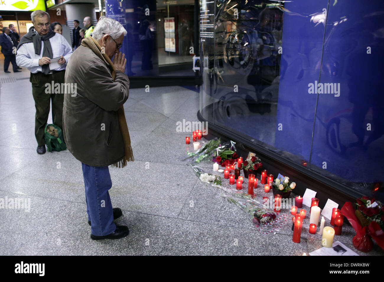 Madrid, Spain. 11th Mar, 2014. A man prays in front of Atocha's Bombing Memorial in Madrid, Spain, Tuesday March 11, 2014, in remembrance of those killed and injured in the Madrid train bombings, marking the 10th anniversary of Europe's worst Islamic terror attack. The attackers targeted four commuter trains with 10 shrapnel-filled bombs concealed in backpacks during morning rush hour on March 11, 2004. Credit:  Rodrigo Garcia/NurPhoto/ZUMAPRESS.com/Alamy Live News Stock Photo