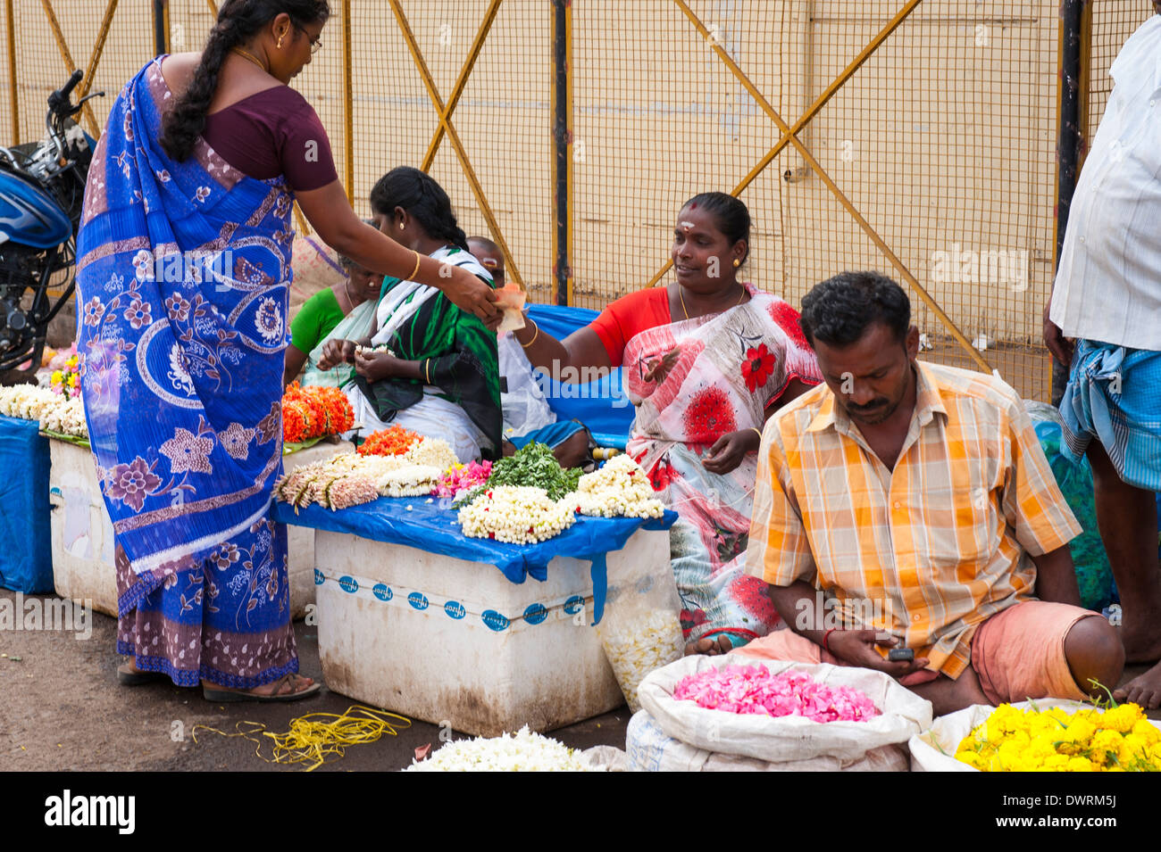 South Southern India Tamil Nadu Madurai flower market entrance jasmine garland mala toran women