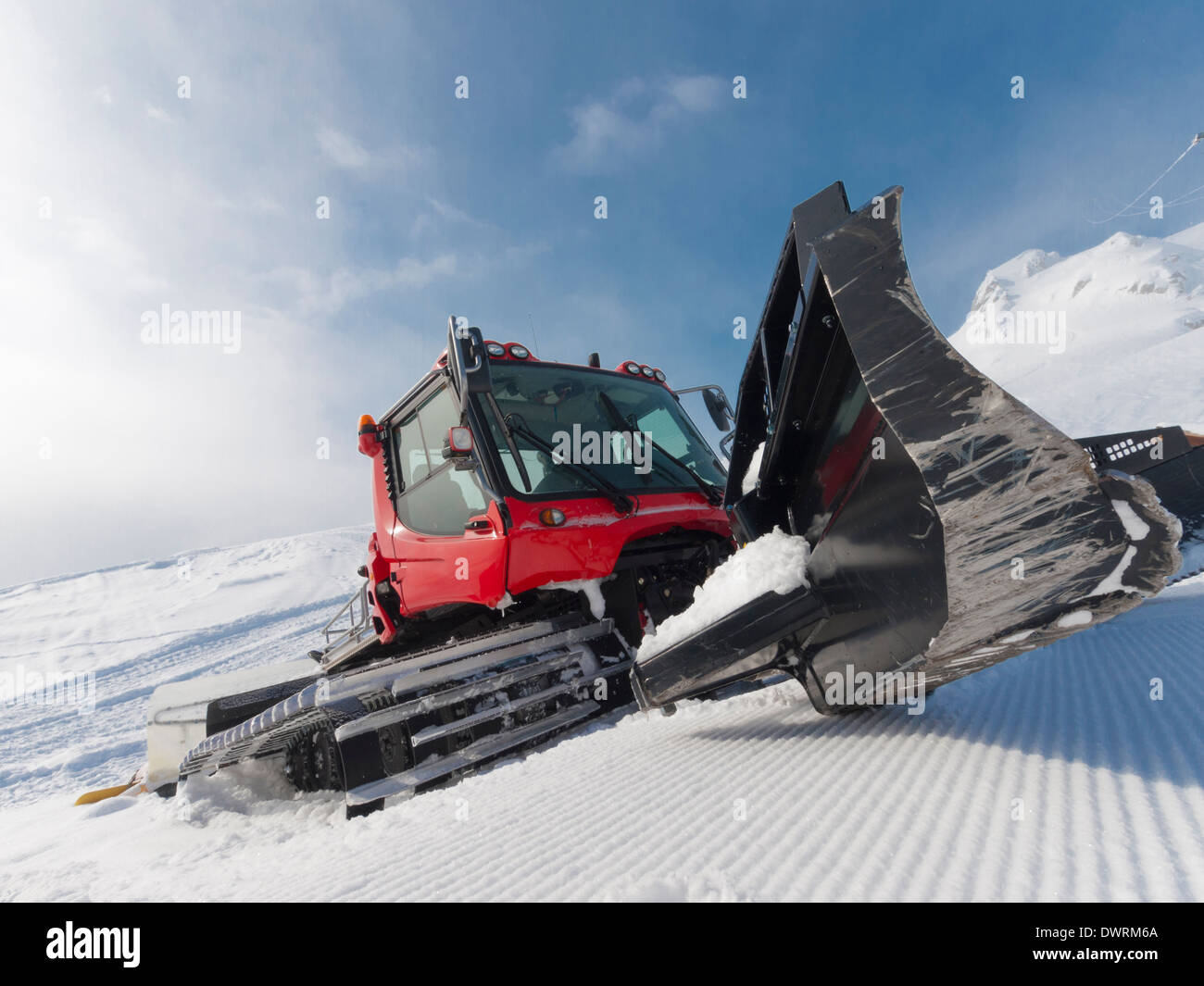 Snowcat for ski slope preparation in a Swiss ski resort. Stock Photo