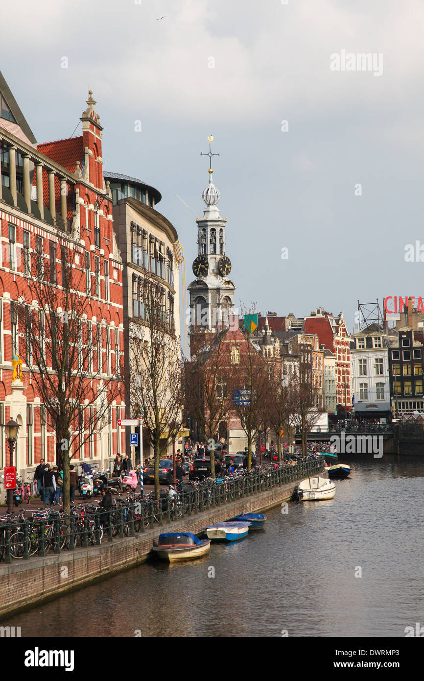 AMSTERDAM, THE NETHERLANDS - MARCH 25, 2011: View on the Singel canal and the famous Munt tower in Amsterdam, The Netherlands. Stock Photo