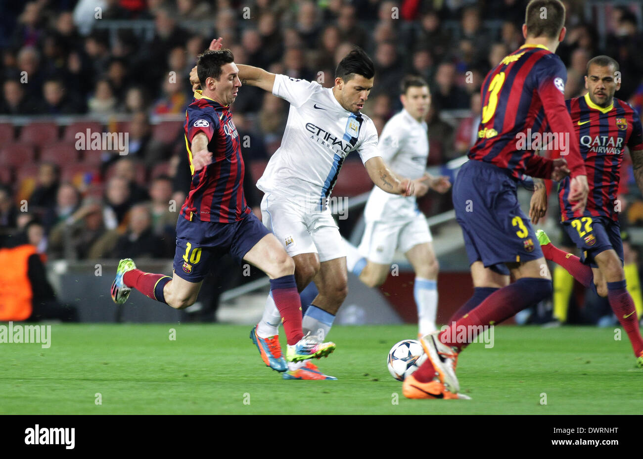 Barcelona, Spain. 12th Mar, 2014. Aguero challenged by Messi during the Champions league game between Barcelona and Manchester City from the Nou Camp Stadium. Credit:  Action Plus Sports/Alamy Live News Stock Photo