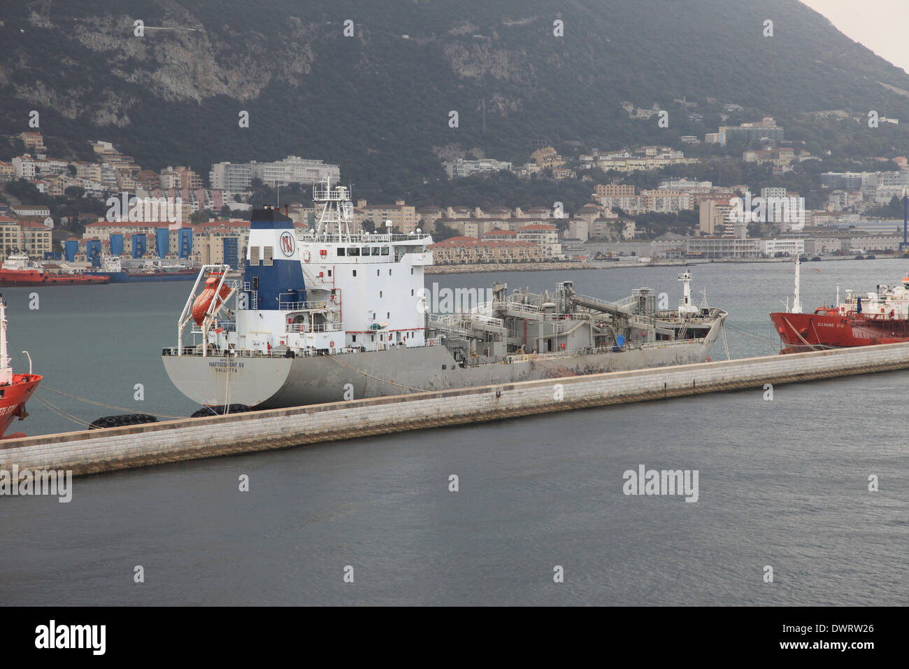 Cement carrier ship mv Naftocement XV alongside the pier at Gibraltar harbor Stock Photo