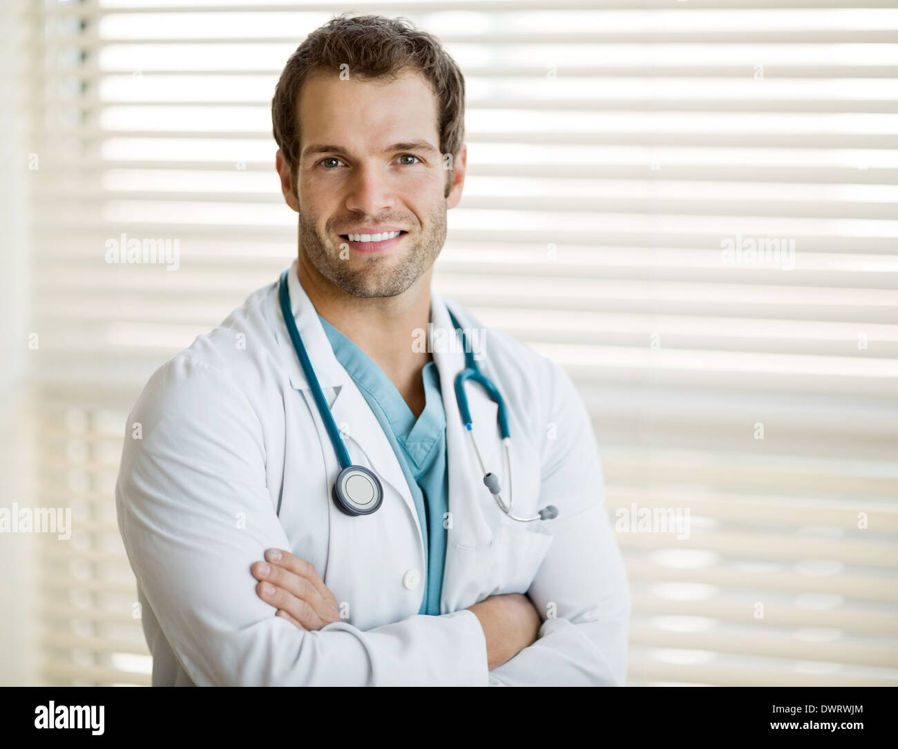 Confident Male Doctor With Arms Crossed Stock Photo Alamy
