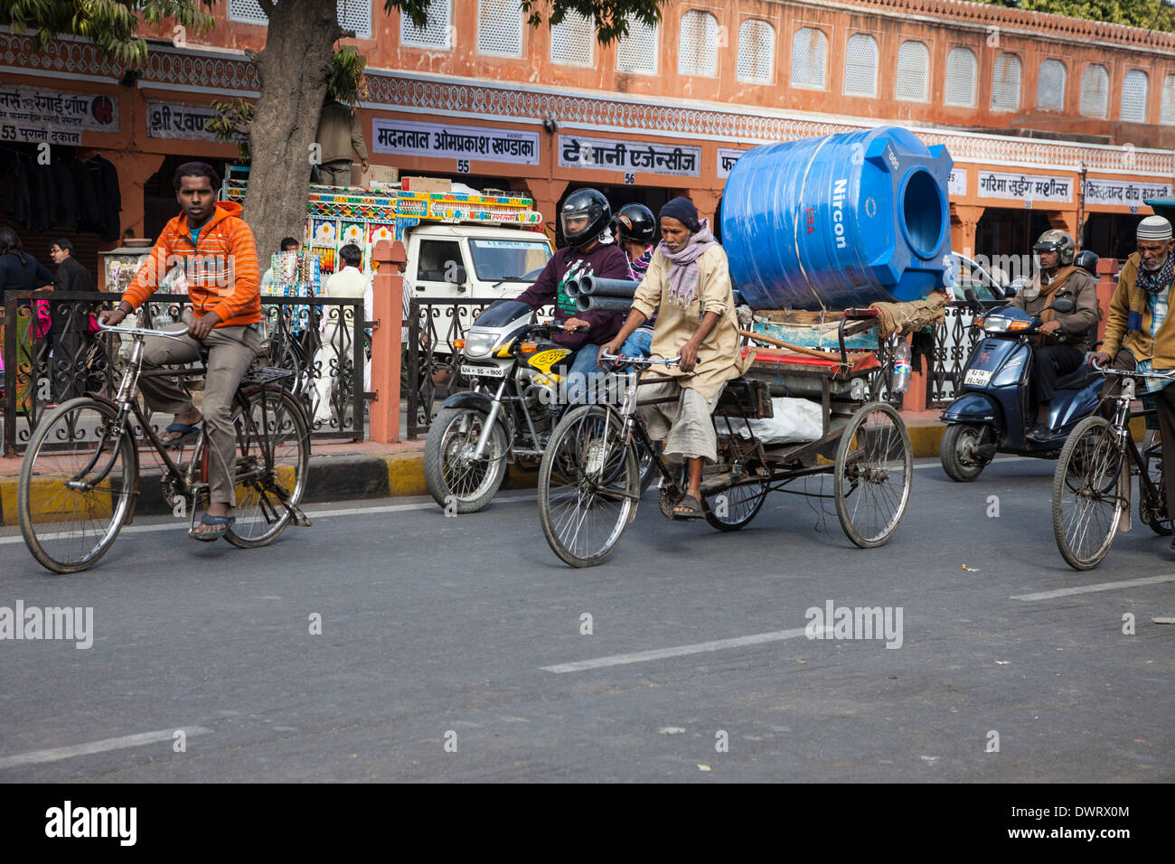 Jaipur, Rajasthan, India. Street Traffic; Rickshaw Carrying Construction Materials. Stock Photo