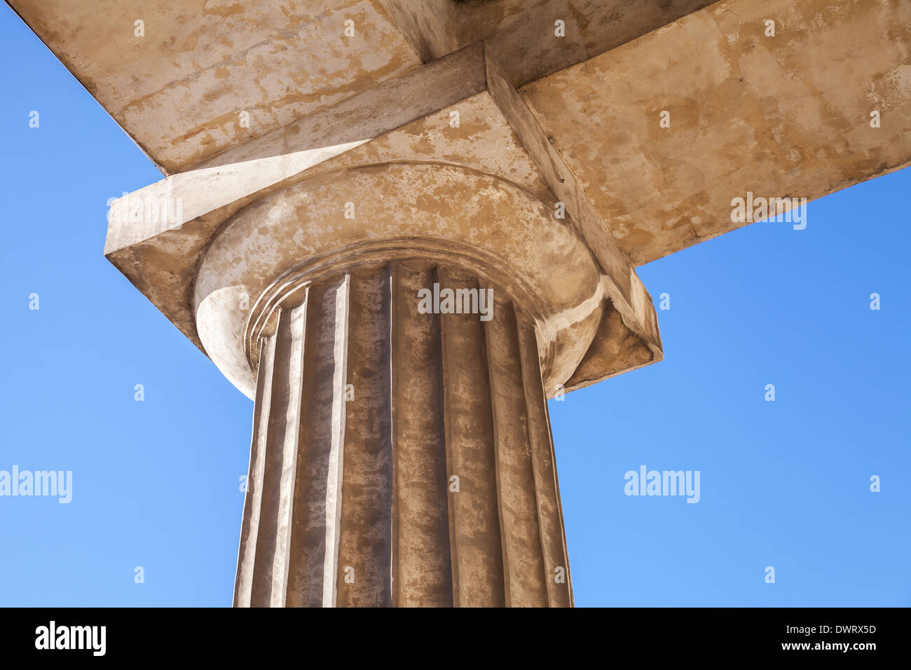 Classical Doric order fragment with upper part of column and capital Stock Photo