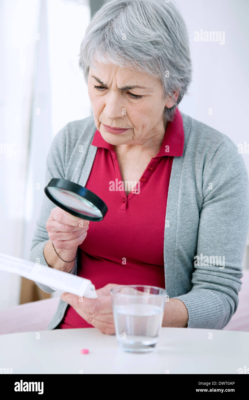 Elderly person taking medication Stock Photo Alamy