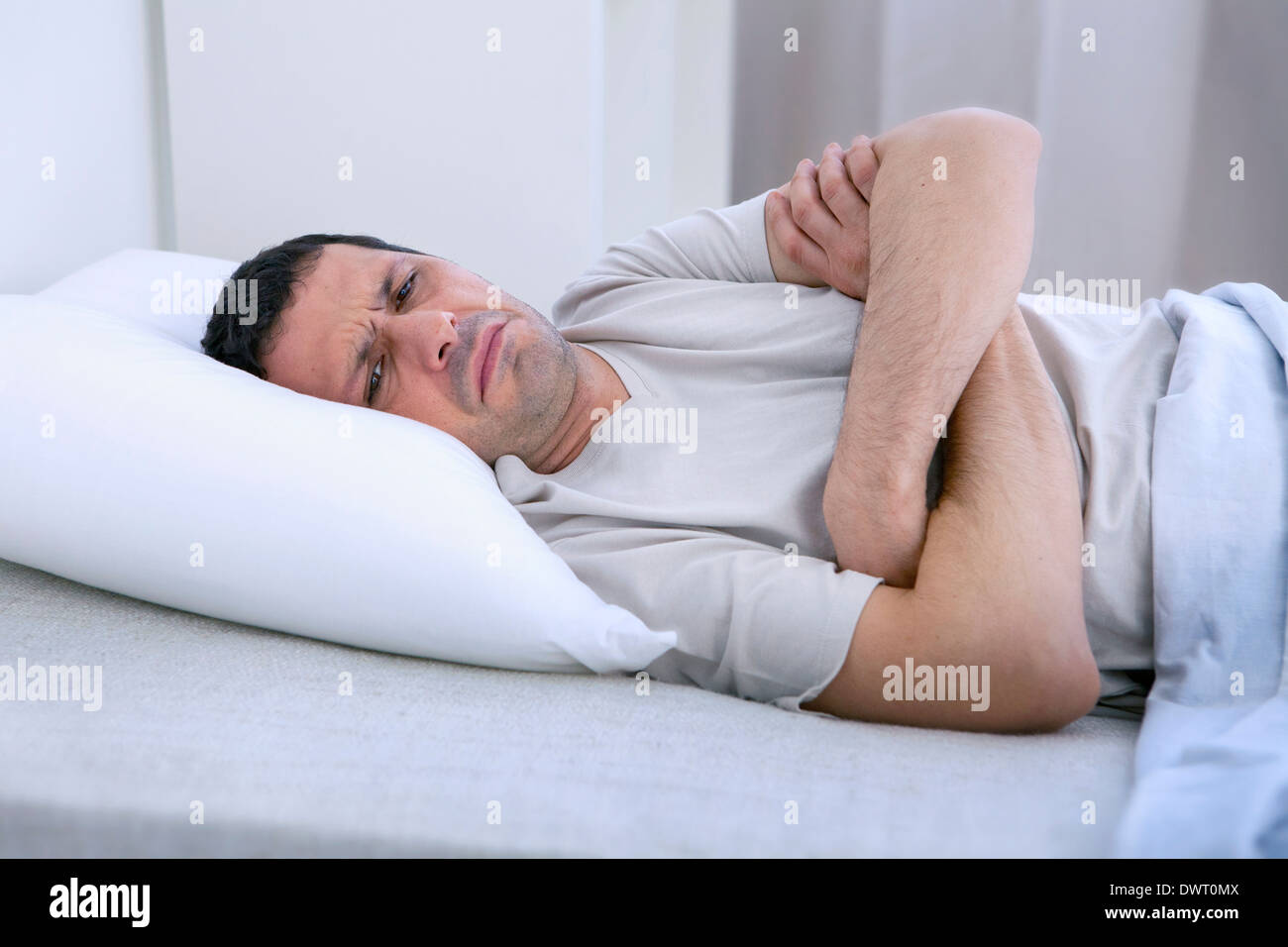 Man with insomnia Stock Photo