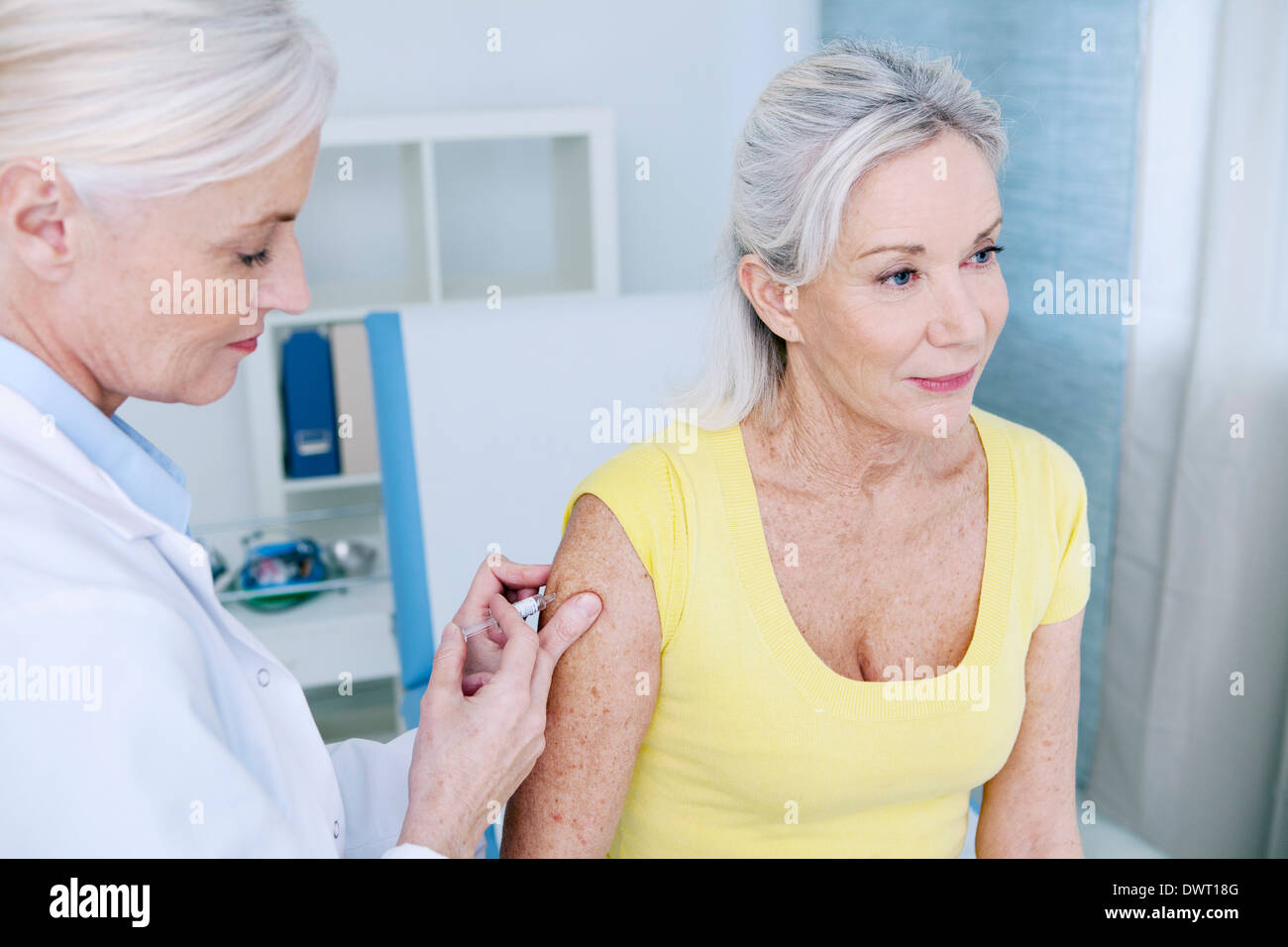 Vaccinating an elderly person Stock Photo