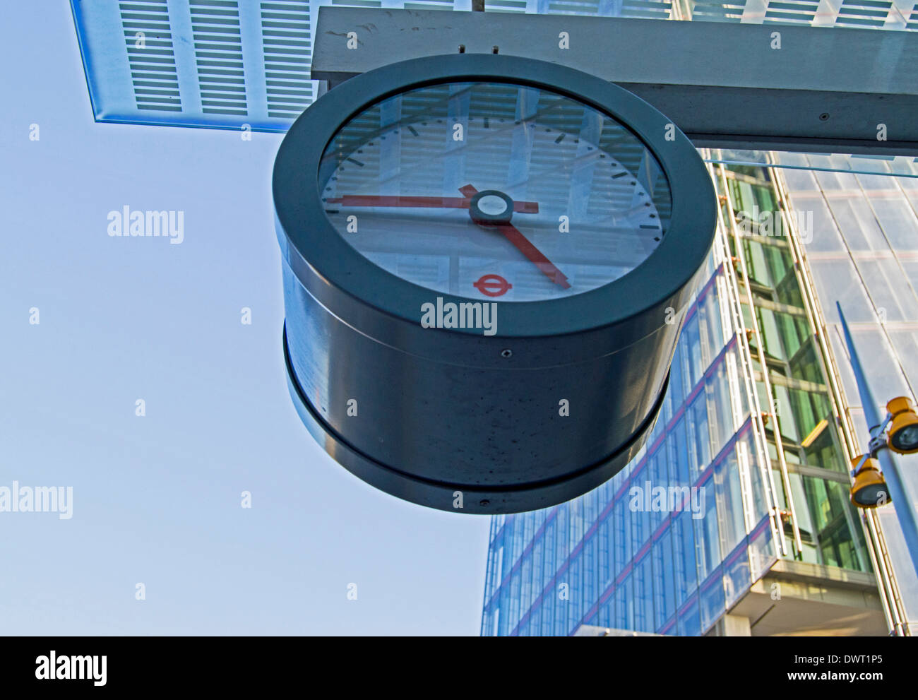 Transport for London clock showing the Shard in background, London