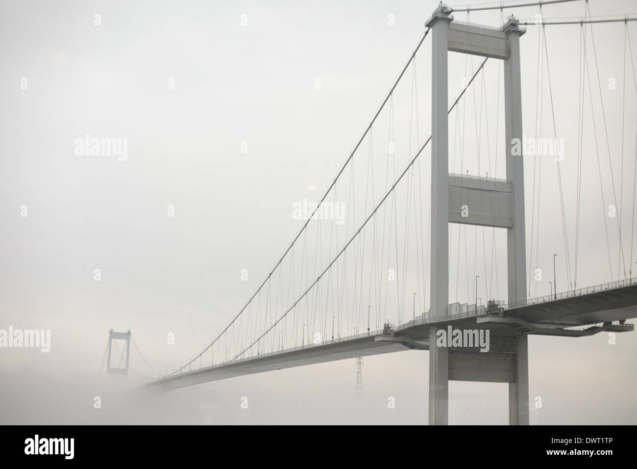 Winter view of the Severn Bridge at Christmas with frost, snow and mist. Taken from the Old Ferry Inn, Beachley Stock Photo