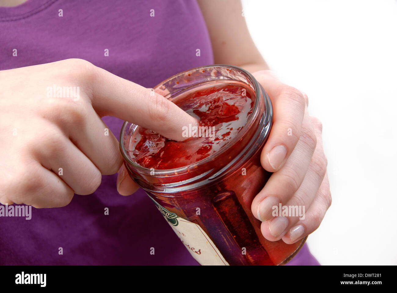 Adolescent eating sweets Stock Photo
