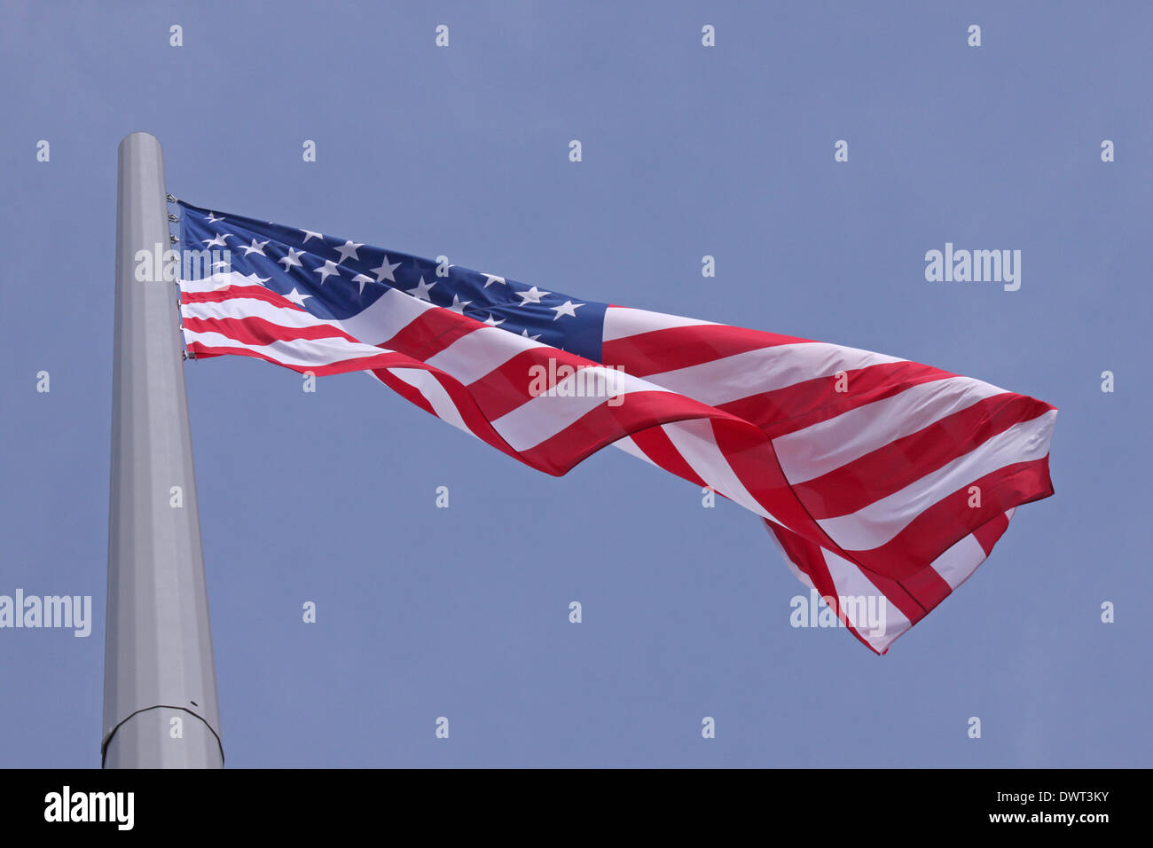 Blue sky with american flag hi-res stock photography and images - Alamy