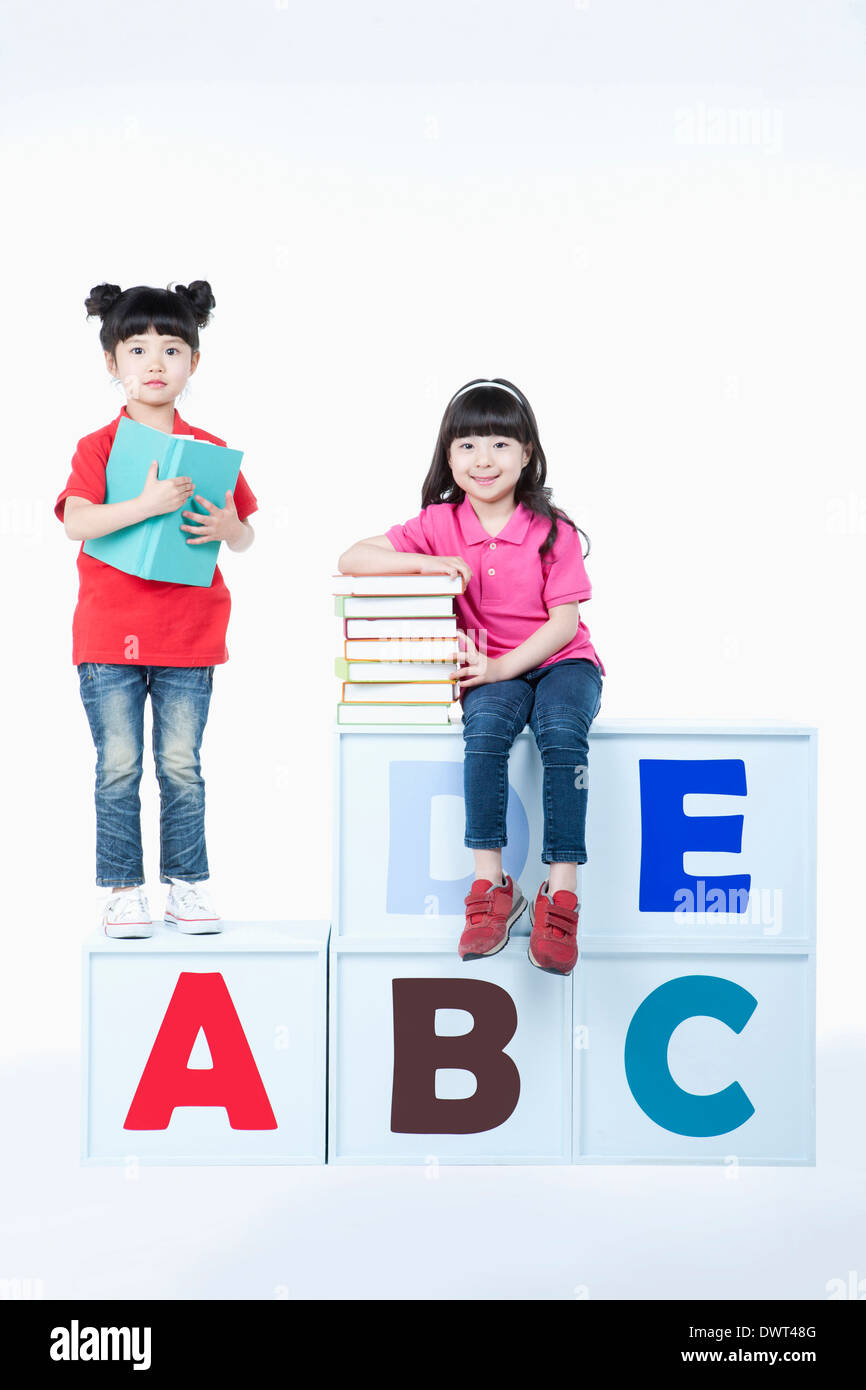Kids sitting on alphabet blocks hi-res stock photography and images - Alamy