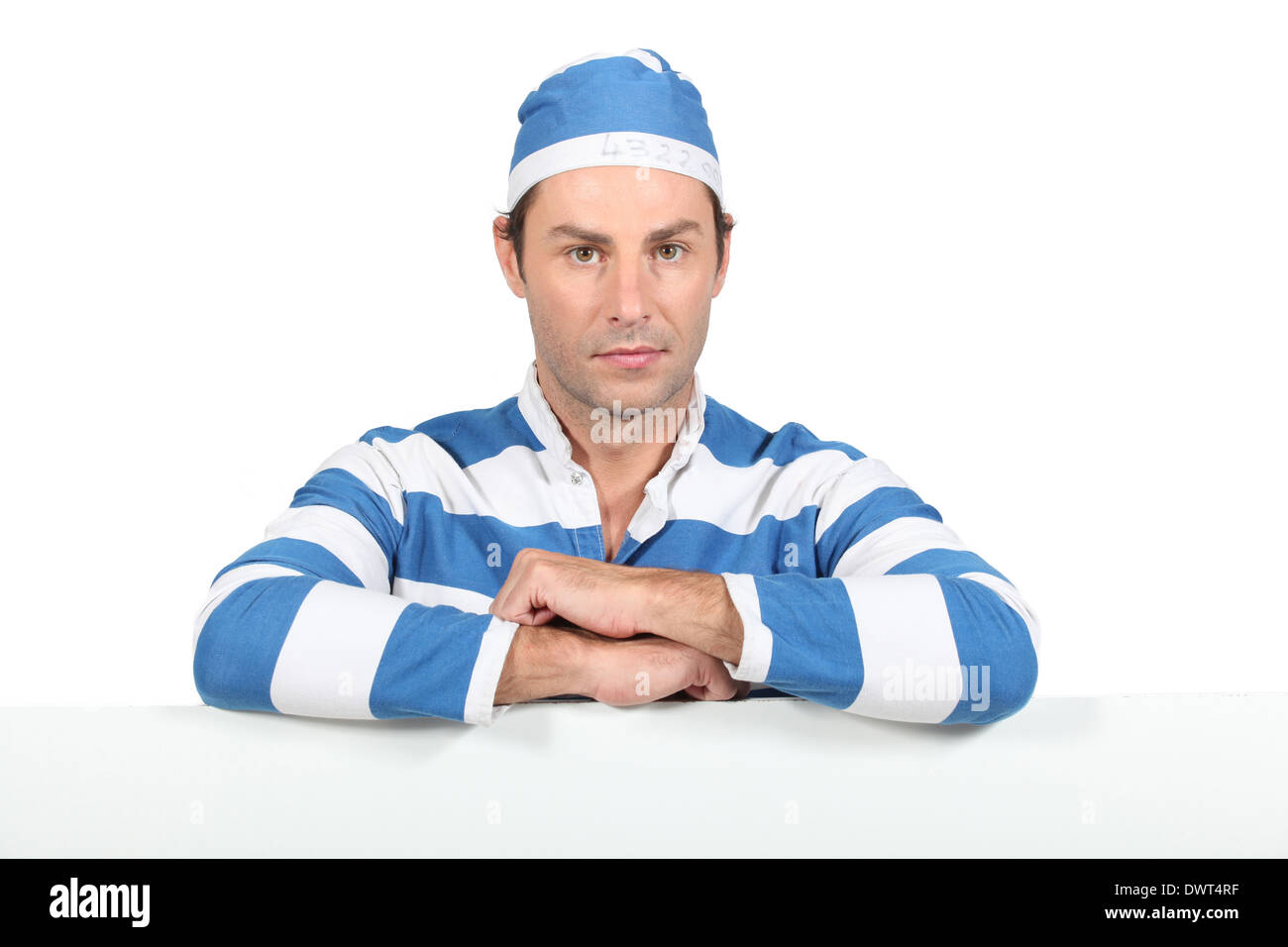 Man in prisoner outfit Stock Photo