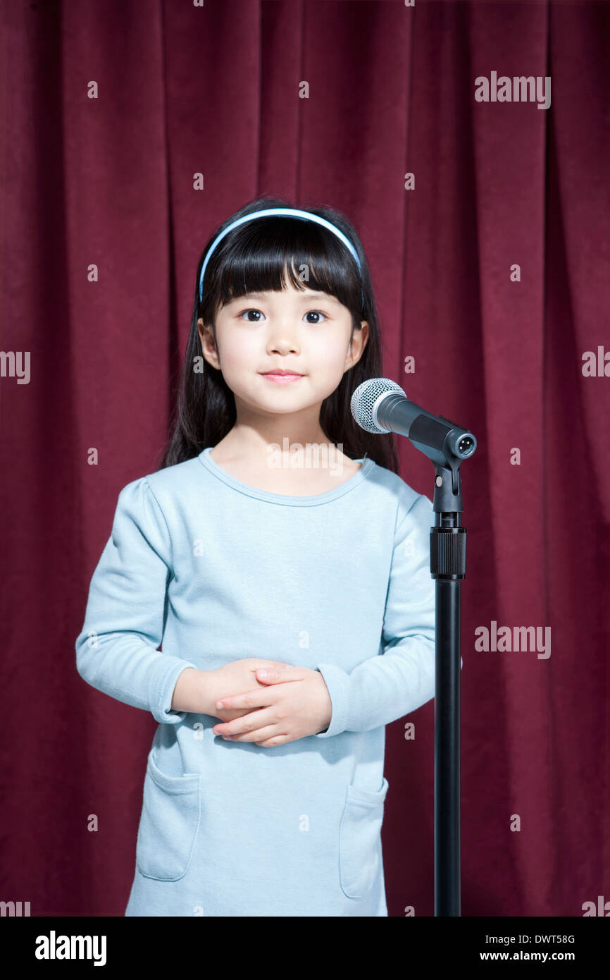 a girl performing on stage Stock Photo - Alamy