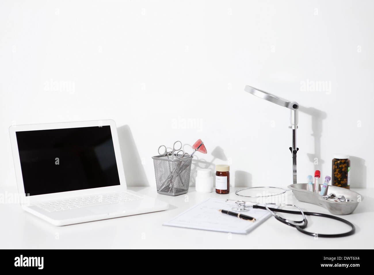 a doctors desk with a laptop Stock Photo Alamy
