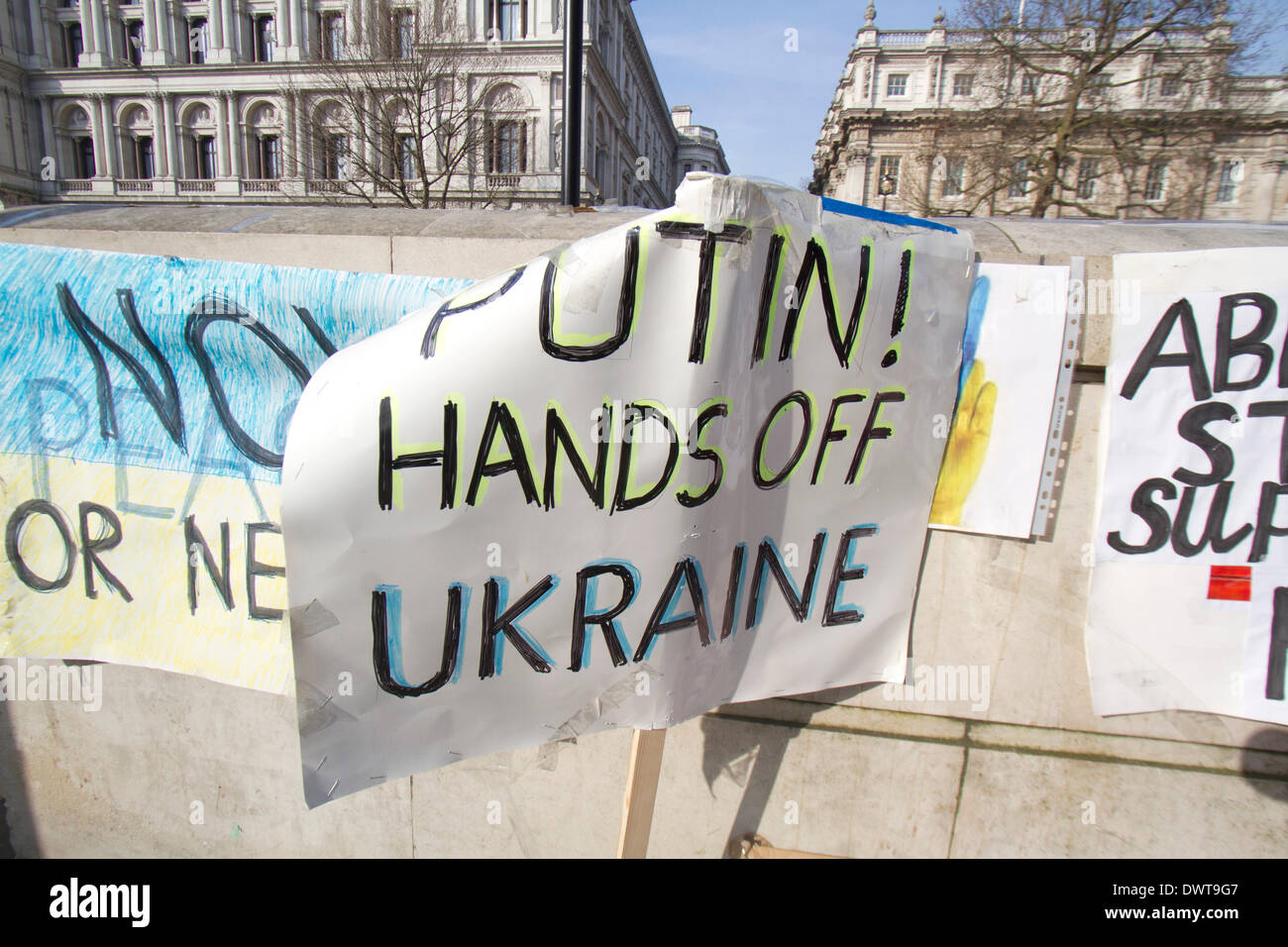 Westminster London, UK. 13th March 2014.Ukrainian protesters continue to hold a 24hour shift protest outside Downing Street with placards following the Russian military intervention in the Crimea demanding on the British Government to impose economic sanctions on the Russian Government Credit:  amer ghazzal/Alamy Live News Stock Photo