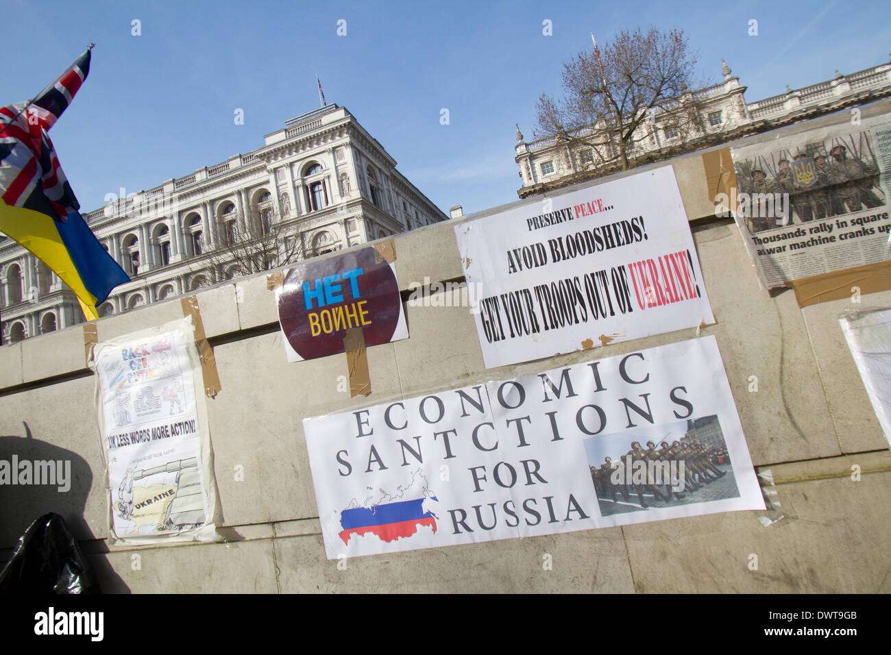 Westminster London, UK. 13th March 2014.Ukrainian protesters continue to hold a 24hour shift protest outside Downing Street with placards following the Russian military intervention in the Crimea demanding on the British Government to impose economic sanctions on the Russian Government Credit:  amer ghazzal/Alamy Live News Stock Photo