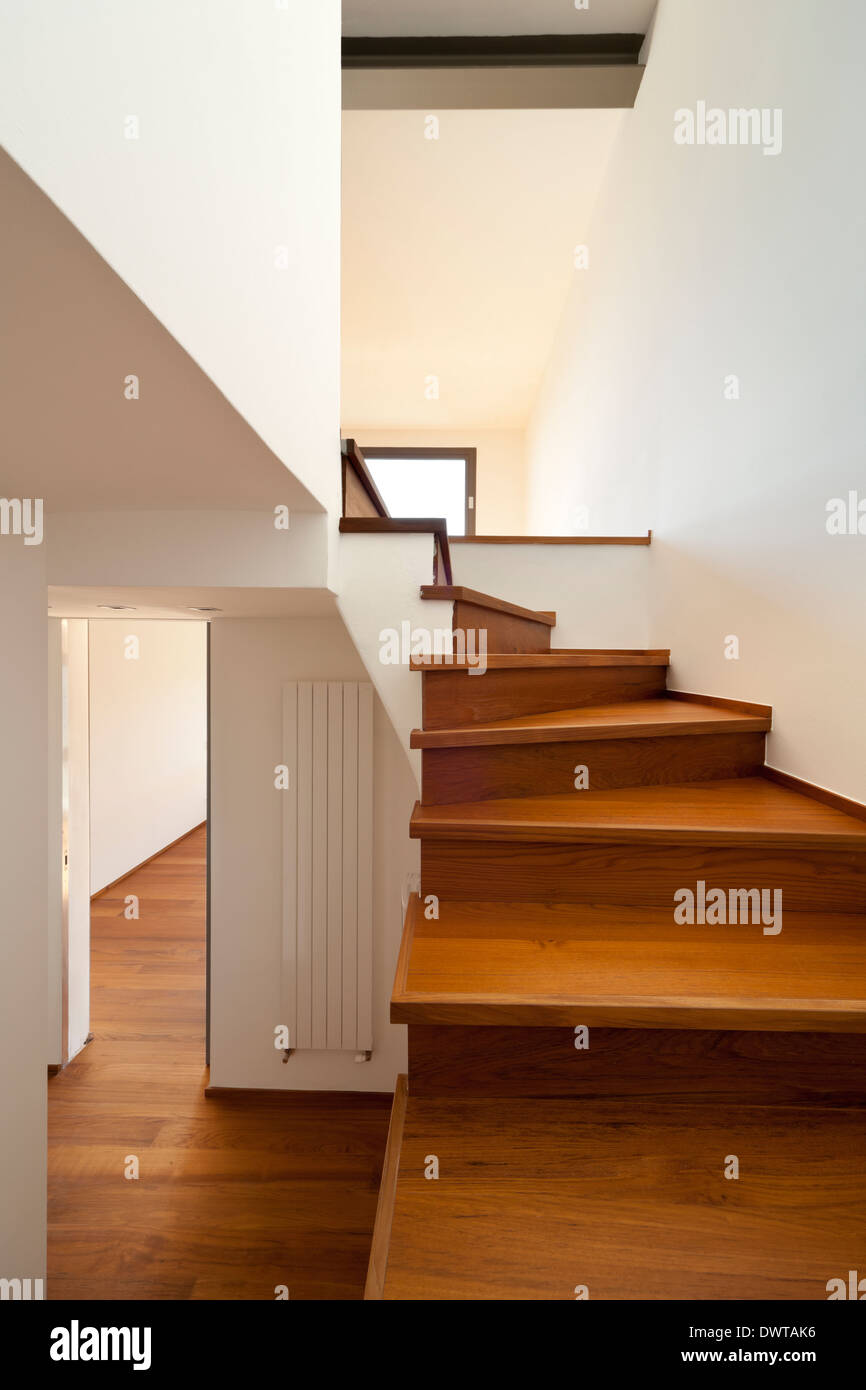 Modern apartment, passage and wooden staircase Stock Photo Alamy