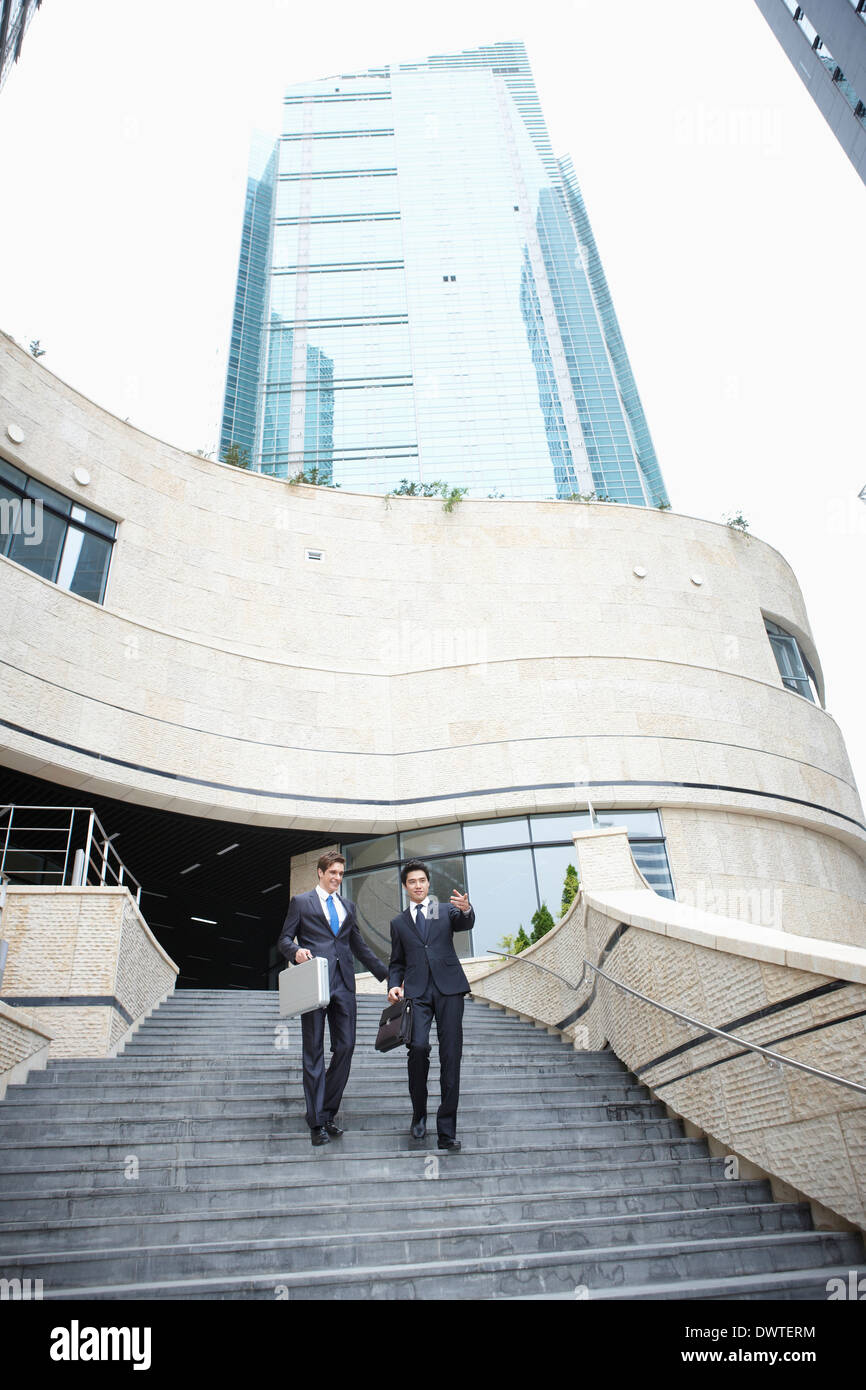 two business men walking the stairs together Stock Photo - Alamy