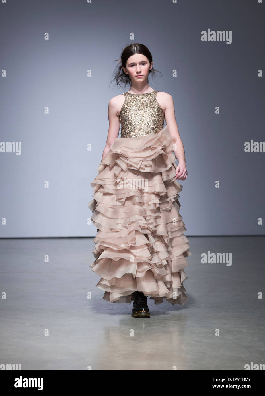 New York, NY - March 08, 2014: Girl walks runway for Mischka Aoki at Vogue Bambini petiteParade Kids Fashion Week at Center 545 Stock Photo