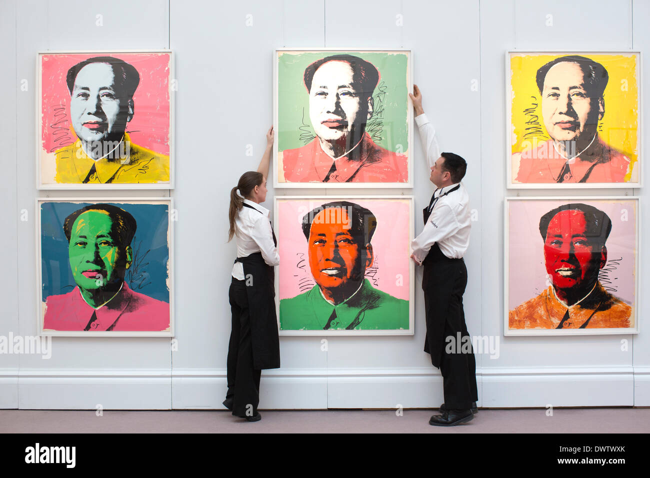 Sotheby's, New Bond Street, London, UK 13th March, 2014. Sotheby's auction of Prints & Multiples, Old Master, Modern and Contemporary, London, UK Curators organise Andy Warhol canvasses of the Chinese communist leader Mao Zedong. Credit:  Jeff Gilbert/Alamy Live News Stock Photo