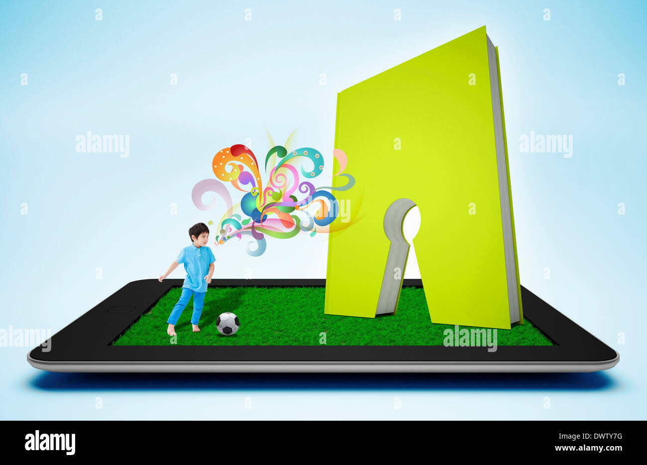 a boy playing soccer on a tablet Stock Photo