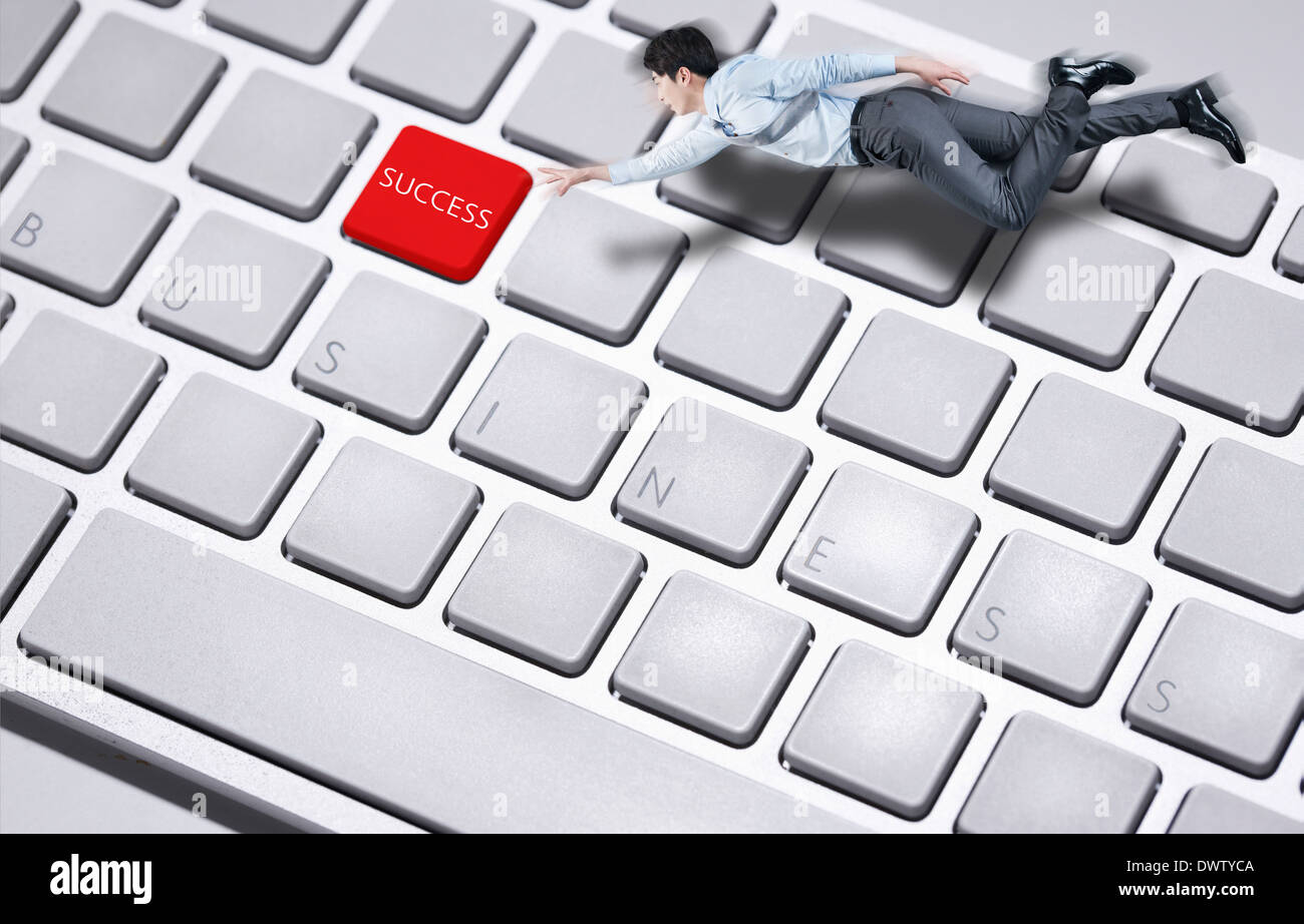 a business man pushing the success button Stock Photo - Alamy
