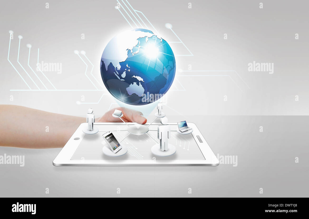 a tablet under the globe Stock Photo