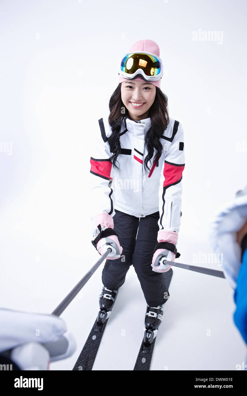 a woman wearing a pair of skis Stock Photo