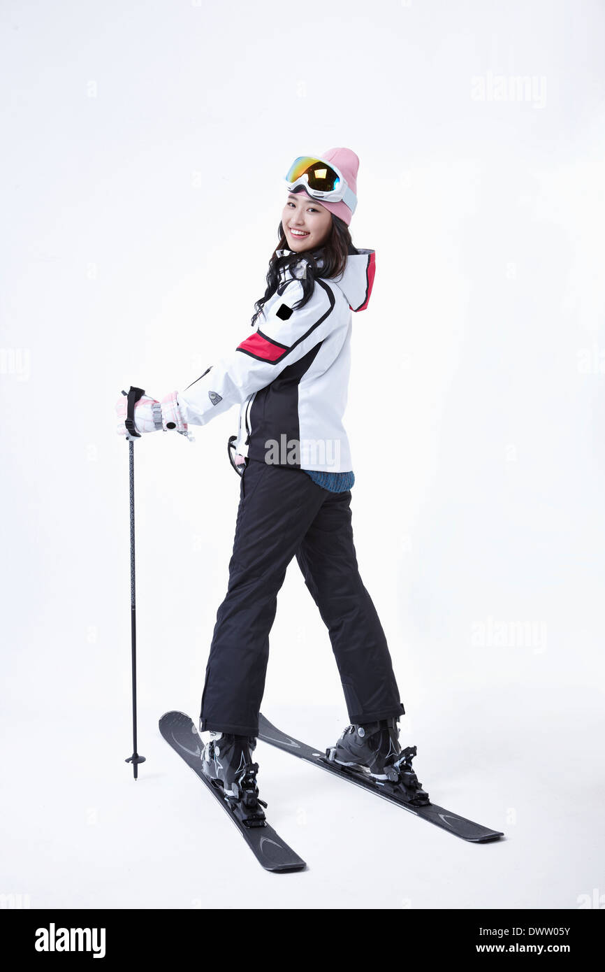 a woman wearing a pair of skis Stock Photo