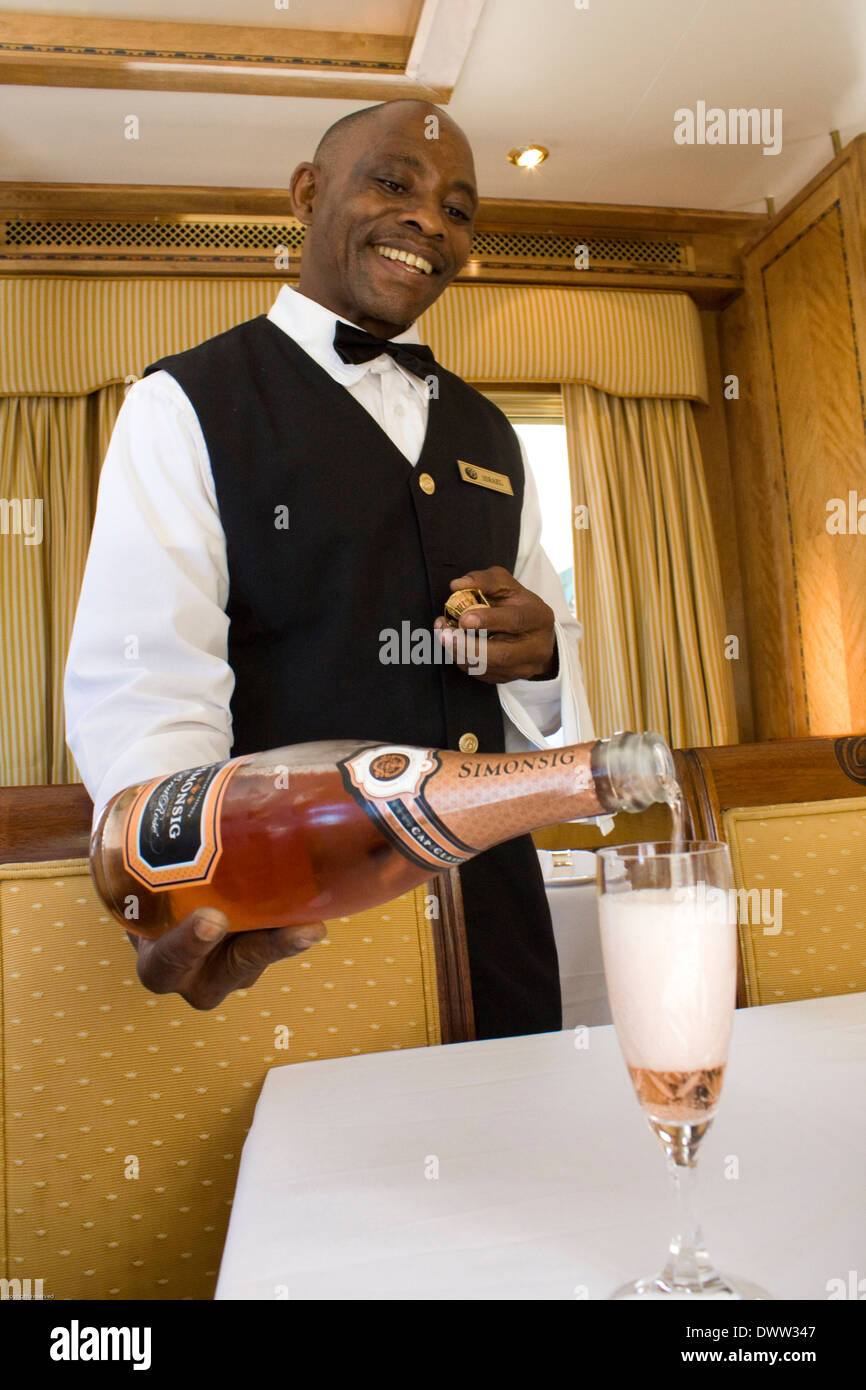 Wine steward Isreal Sithebe suggest a Cap Classique Rose Brut for brunch. Stock Photo