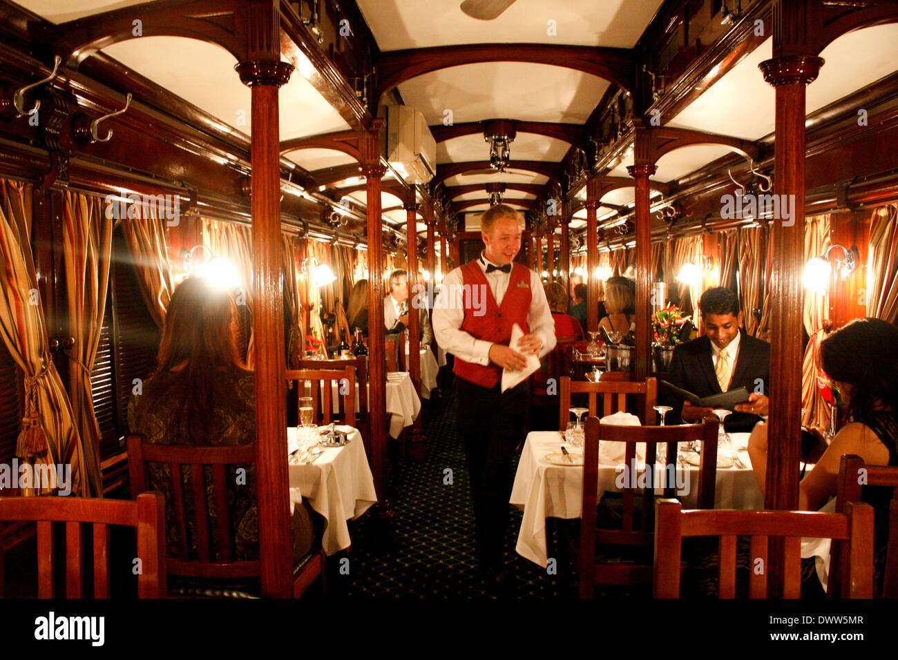 The dining car on board the luxurious Rovos Rail steam train has been restored to its former