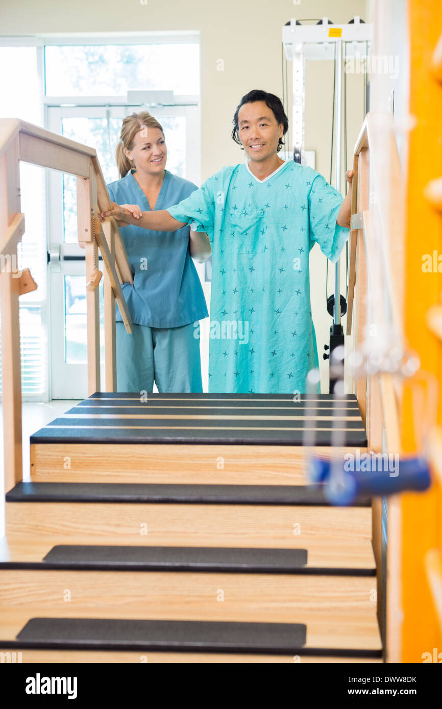 Patient Being Assisted By Physical Therapist Stock Photo